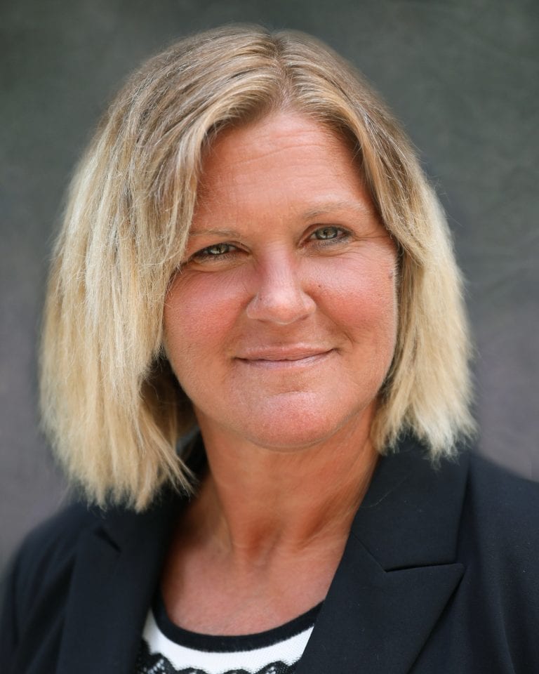 Kelly-headshot-on-website-768x960